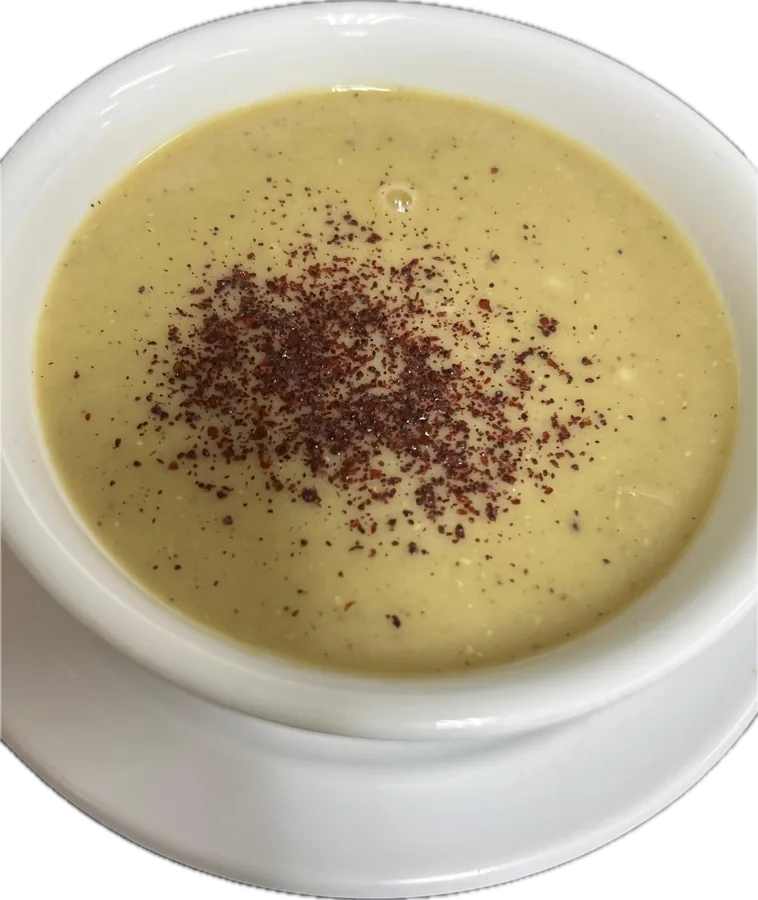 Bowl of lentil soup topped with sumac